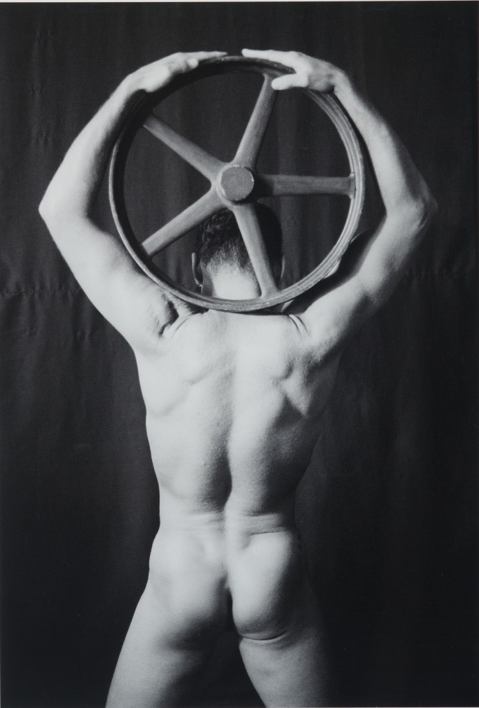 Male Nude with Wooden Wheel, 1988, Roger L. Crossgrove, gelatin silver print. (Benton Museum/UConn Photo)