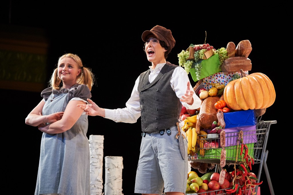 Katelyn Lewis ’15 (SFA) as Gretel and Caroline O’Dwyer ’11 (SFA) as Hansel stumble upon shopping carts filled with candy, fruit, and junk food. (Peter Morenus/UConn Photo)