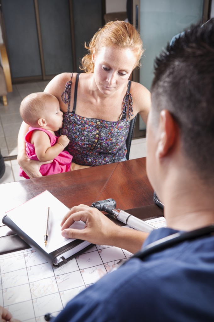 A new mother speaks with a health care professional about depression. (iStock Photo) 