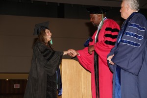 2011: UConn Board of Trustees Director Larry McHugh watches Dr. Cato Laurencin, dean of the UConn School of Medicine, congratulate Mona Shahriari at commencement. (Photo by John Atashian)
