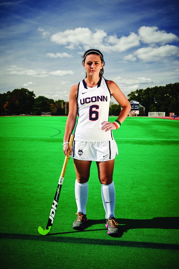 Rosin Upton holding her field hockey stick on the field at the Sherman Family Sports Complex on Sept. 25, 2015. (Peter Morenus/UConn Photo)