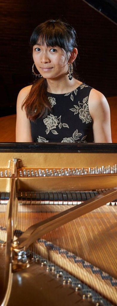 Calliope Wong poses for a portrait at the piano onstage at von der Mehden Recital Hall on Sept. 30, 2015. (Peter Morenus/UConn Photo)