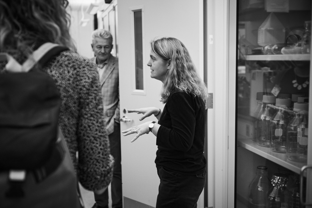 Stormy Chamberlain leads journalists on a tour of her lab at the Cell and Genome Sciences Building in Farmington on March 15, 2016. (Peter Morenus/UConn Photo)