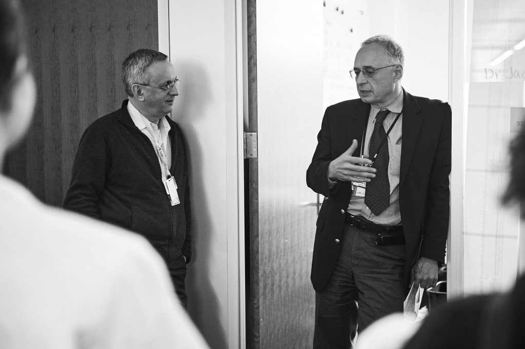 Jacques Banchereau, left, and George Kuchel, professor of medicine, speak with journalists visiting The Jackson Laboratory at UConn Health in Farmington on March 15, 2016. (Peter Morenus/UConn Photo)