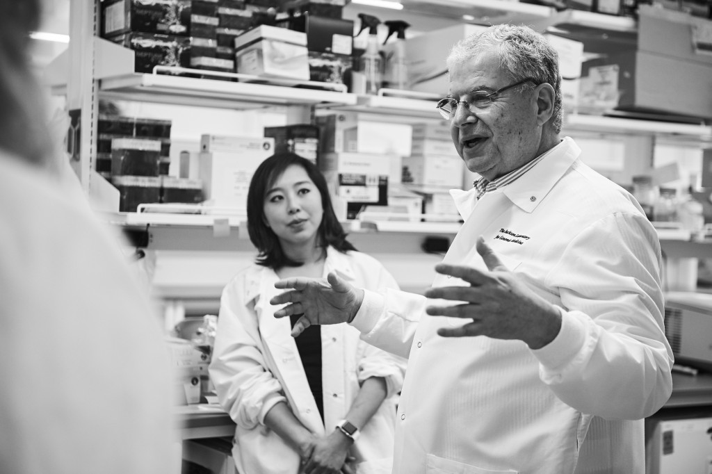 George Weinstock, Evnin family chair and director of microbial genetics, right, and Julia Oh, assistant professor of genetics and genome sciences, speak with journalists visiting The Jackson Laboratory at UConn Health in Farmington on March 15, 2016. (Peter Morenus/UConn Photo)