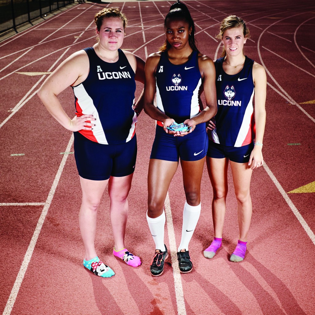 Megan Chapman, left, Odrine Belot, and Alana Pearl on the track at the Sherman Family Sports Complex on Sept. 18, 2015. (Peter Morenus/UConn Photo)