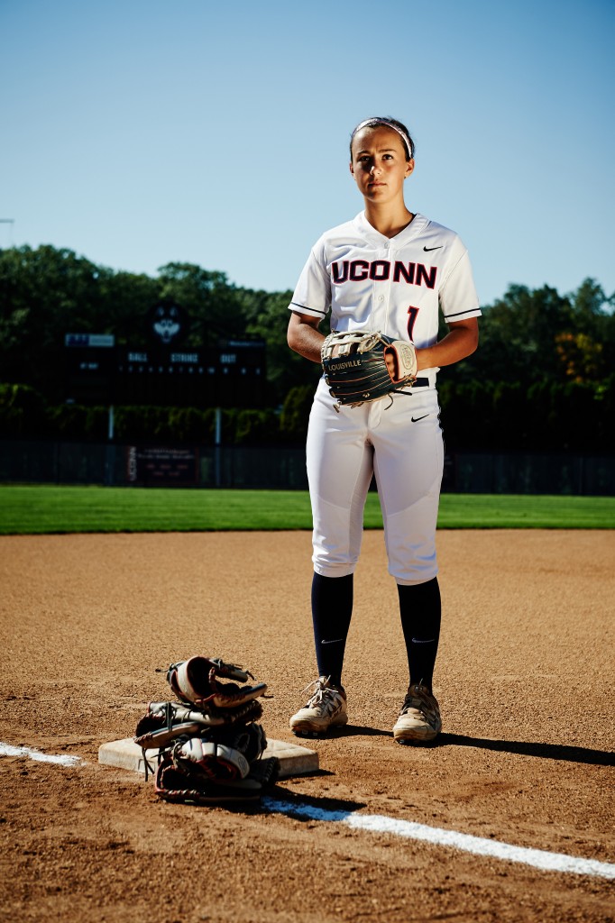 Heather Fyfe with gloves at the Connecticut Softball Stadium on Sept. 18, 2015. (Peter Morenus/UConn Photo)