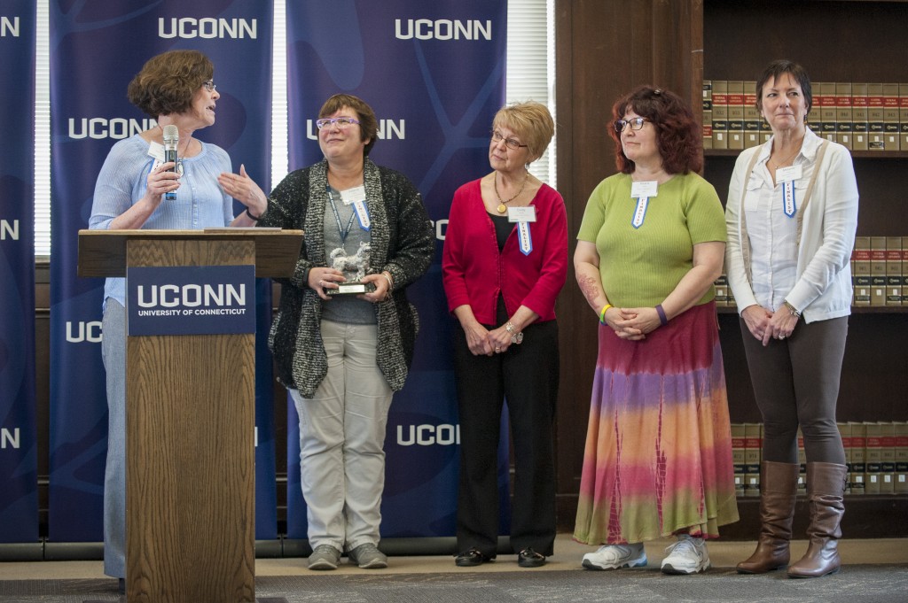 Left to right, Pat Moriarty, Valerie Kiefer, Cindy Walsh, Hilarie Jones, Melanie Kraus, and Virginia Shea (not pictured), of Student Health Services Sexual Assault Team received the Team Award at the UConn Spirit Awards ceremony on March 8, 2016. (Sean Flynn/UConn Photo)