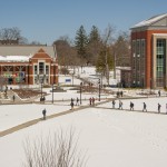Walking across campus with snow on  April 5, 2016. (Sean Flynn/UConn Photo)
