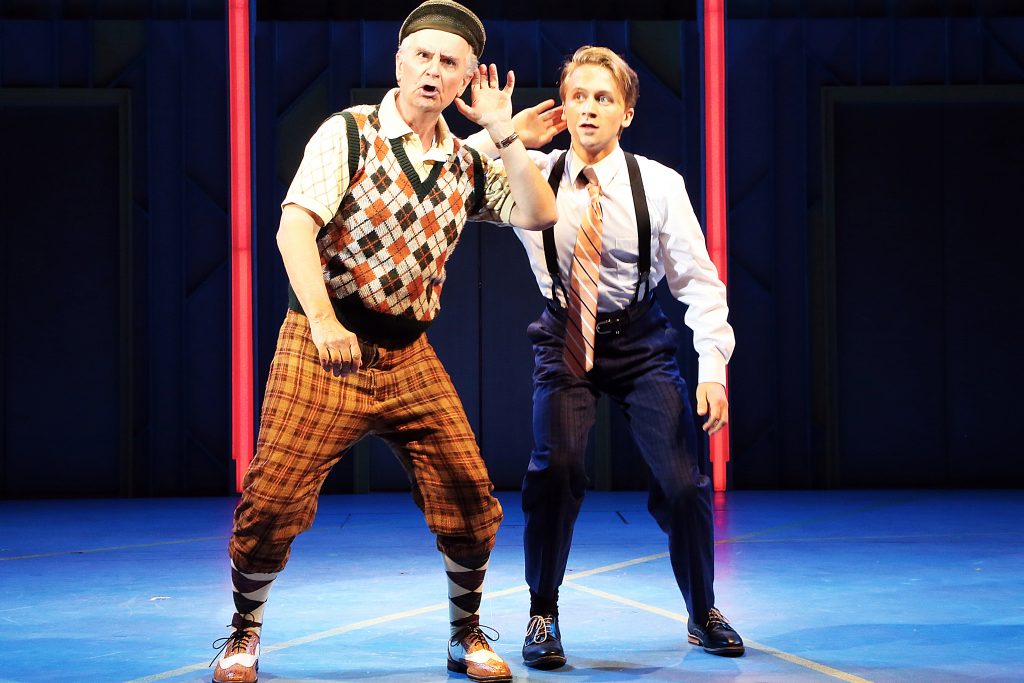 Fred Grandy (Biggley), left, and Riley Costello (Finch) in 'How to Succeed in Business Without Really Trying,' onstage June 2-12, 2016 at Connecticut Repertory Theatre’s Harriet S. Jorgensen Theatre. (Gerry Goodstein for UConn)