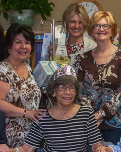 Dr. Dawn Murphy (rear center) celebrates the birthday of a patient for whom she provided post-acute care following discharge from UConn John Dempsey Hospital to the Avon Health Center. (Photo by Robin Baker)