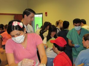 UConn dental school volulnteers provide free screenings and preventive services at the Special Smiles clinic. 