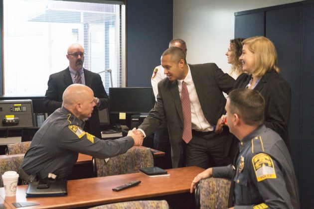 Alumnus Robert Hotaling ’01 (ENG) meets with members of the UConn Police