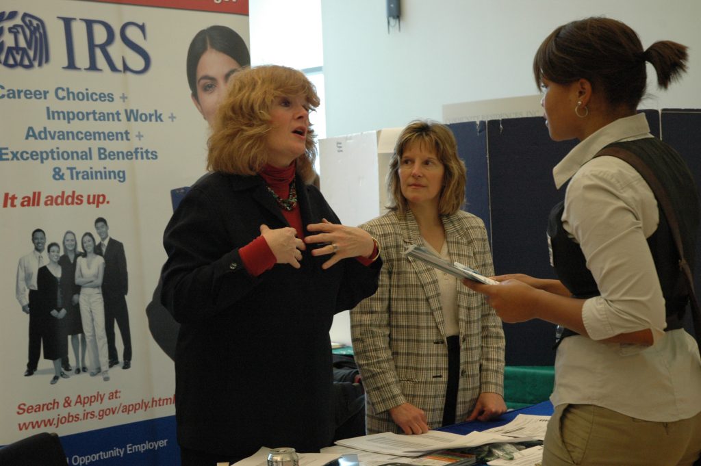 Maryann Colburn, left, from the Internal Revenue Service, speaks with Falak Campbell '10 (CLAS), a psychology major, at the Careers for the Common Good Fair. (UConn File Photo)