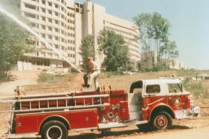 Dave Smith, the first firefighter hired by UConn Health, tests the hose on Engine 1 on a UConn Health campus where the road paving wasn't complete yet. (Photo provided by Dave Smith)