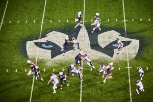 A view of the husky logo at mid-field during a football game at Pratt & Whitney Stadium at Rentschler Field on Sept. 1, 2016. (Peter Morenus/UConn Photo)