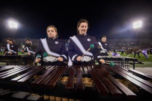 The UConn Marching Band members play marimba during a football game at Pratt & Whitney Stadium at Rentschler Field on Sept. 1, 2016. (Peter Morenus/UConn Photo)