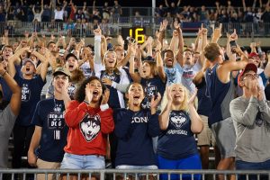 Students cheer during a football game at Pratt & Whitney Stadium at Rentschler Field on Sept. 1, 2016. (Peter Morenus/UConn Photo