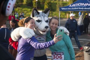 Left to right, Dylan Beaton and Darby Muia pose with Jonathan before running in the Huskies Forever 5k on Sunday morning.  Oct. 16, 2016. (Garrett Spahn/UConn Photo)