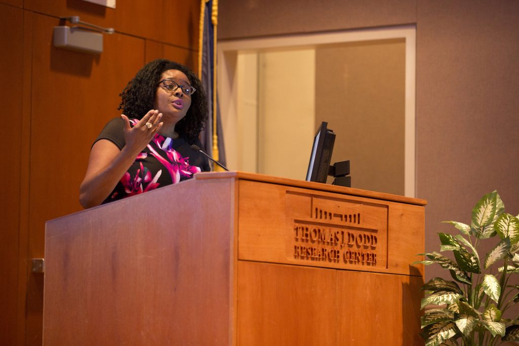 Associate Professor of Political Science and leader of The Collaborative at UConn Shayla Nunnally welcomes participants to the kickoff event for the research initiative on women and girls of color on Sept. 28. Photo by Bri Diaz.