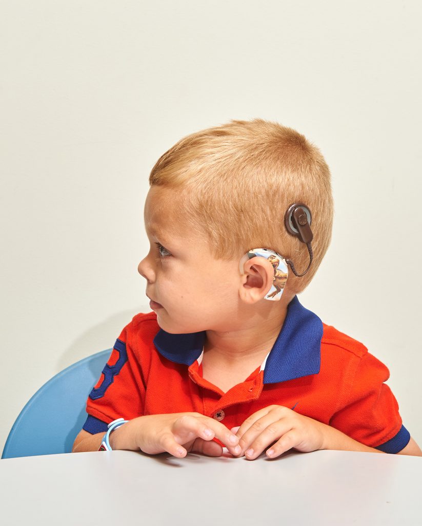 A child with a cochlear implant. (Peter Morenus/UConn Photo)