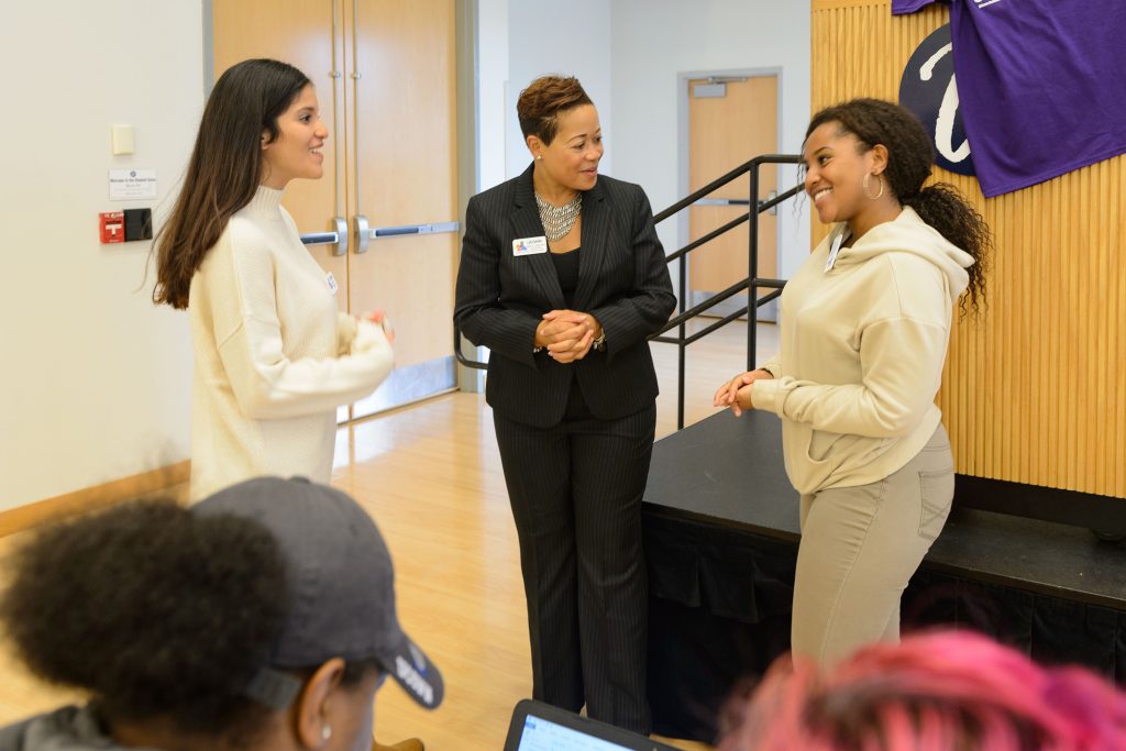Joelle Murchison speaks with students before a forum on the recent violence seen in Orlando held at the Student Union Ballroom on Oct. 4, 2016. (Peter Morenus/UConn Photo)