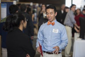 Matthew Lin ’18 (CLAS) discusses his research at the Fall Frontiers in Research Poster Exhibition in Wilbur Cross South Reading Room on Oct. 26, 2016. (Ryan Glista '16 (CLAS)/UConn Photo)