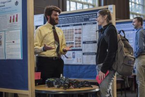 Gregory Bicknell ’16 (ENG) discusses his research at the Fall Frontiers in Research Poster Exhibition in Wilbur Cross South Reading Room on Oct. 26, 2016. (Ryan Glista '16 (CLAS)/UConn Photo)
