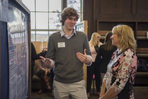 Ryan Thibodeau ’17 (CLAS) discusses his research at the Fall Frontiers in Research Poster Exhibition in Wilbur Cross South Reading Room on Oct. 26, 2016. (Ryan Glista '16 (CLAS)/UConn Photo)
