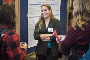 Tessa Kell ’17 (CAHNR) discusses her research at the Fall Frontiers in Research Poster Exhibition in Wilbur Cross South Reading Room on Oct. 26, 2016. (Ryan Glista '16 (CLAS)/UConn Photo)
