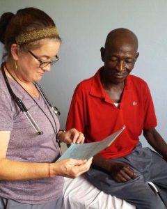 Dr. Susan Levine with a patient in Jeremie, Haiti, where she spent nearly two weeks on a relief mission following Hurricane Matthew. (Photo provided by Susan Levine)