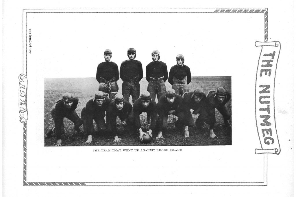 The Connecticut Agricultural College football team in 1923. Although the colors of their uniforms can't be determined from this black and white photo, the opponent, Rhode Island, wore white and blue so it's possible the 'Aggies' donned orange jerseys for the game. (Archives & Special Collections, UConn Library)