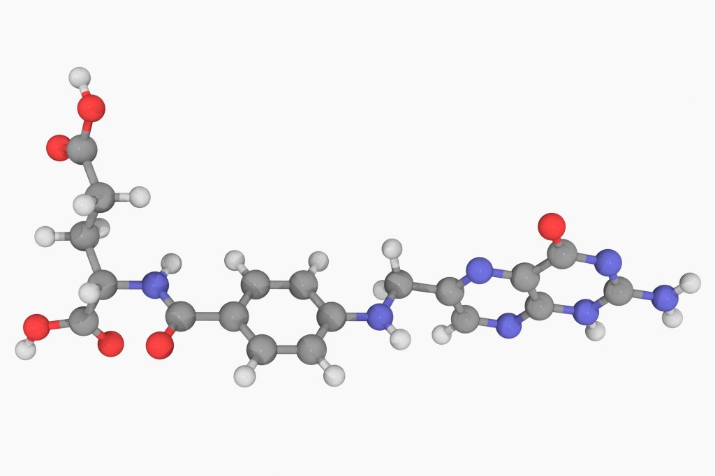 Folic acid (vitamin B9), molecular model. Atoms are represented as spheres and are colour-coded: carbon (grey), hydrogen (white), nitrogen (blue) and oxygen (red). (Laguna Design/Getty Images)