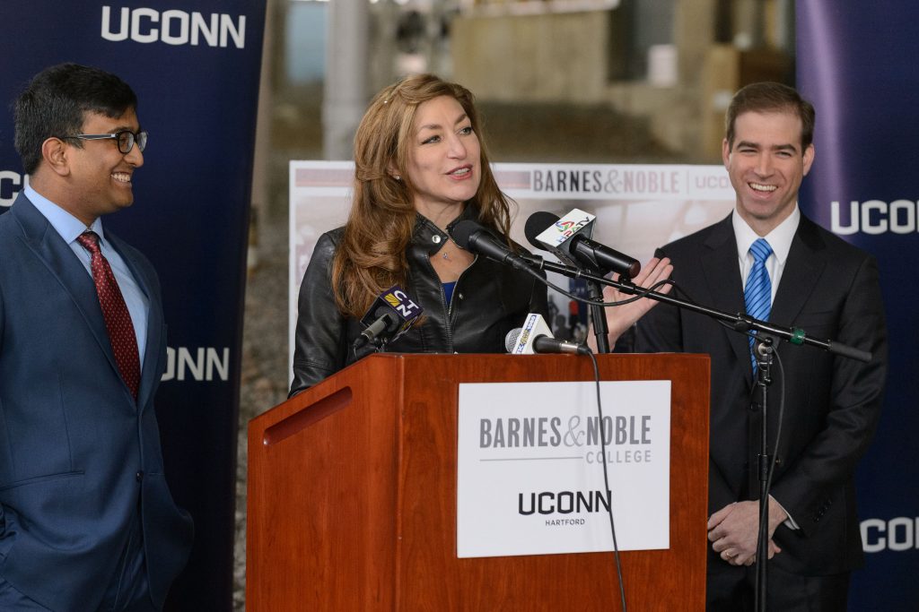 President Susan Herbst introduces UConn Hartford student body president Syed Naqvi, left, at a press conference held on Jan. 25, 2017 to announce the site selection for a new UConn Bookstore operated by Barnes & Nobleadjacent to the new UConn Hartford campus. At right is Mayor Luke Bronin. (Peter Morenus/UConn Photo)
