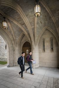 Walking through the arch at UConn School of Law. (Sean Flynn/UConn Photo)