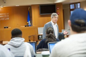 Listening to a lecture by Timothy Everett at the School of Law. (Sean Flynn/UConn Photo)
