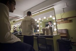 Troy Frey '19 (SFA), left, and Luke Powers '19 (SFA) in the dressing room at Jorgensen before the dress rehearsal of H.M.S. Pinafore on Jan. 24, 2017. (Sean Flynn/UConn Photo)