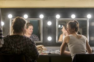 Judy Bowers DMA '17, left, and Caroline O'Dwyer '11 (SFA), '18 DMA in the dressing room at Jorgensen before the dress rehearsal of H.M.S. Pinafore on Jan. 24, 2017. (Sean Flynn/UConn Photo)