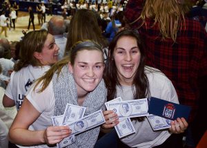 After the game, fake $100 bills featuring Coach Geno Auriemma's photo wafted down from the rafters. (Jack Templeton/UConn Photo)