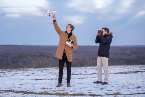 Fritz Bacon, left, operates a drone, while Scott Washburn of the UConn Photo Club takes a picture on Feb. 2, 2017. (Ryan Glista/UConn Photo)