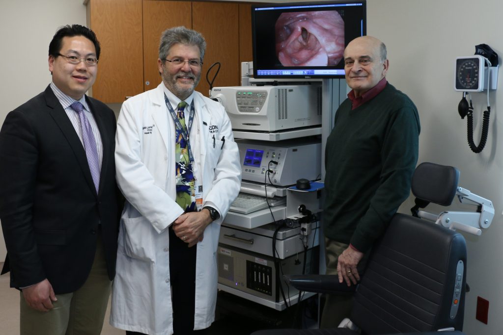 UConn Health patient Ed Favolise, right, with Dr. Andrew Chen, chief of the Division of Plastic Surgery, left, and Dr. Denis Lafreniere, chief of the Division of Otolaryngology, after surgery that restored his voice using his own body’s fat cells. (Frank Barton/UConn Health Photo)