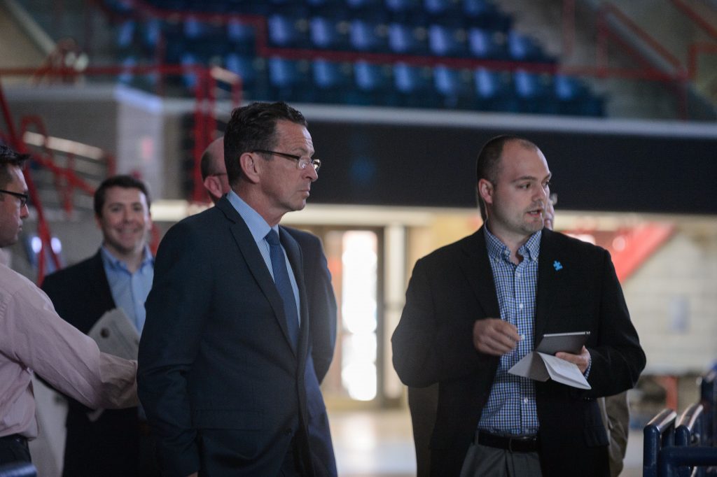 Anthony Rosati, facility manager, shows Gov. Dannel Malloy how the new energy saving lighting is controlled at Gampel Pavilion on April 18, 2017. (Peter Morenus/UConn Photo)