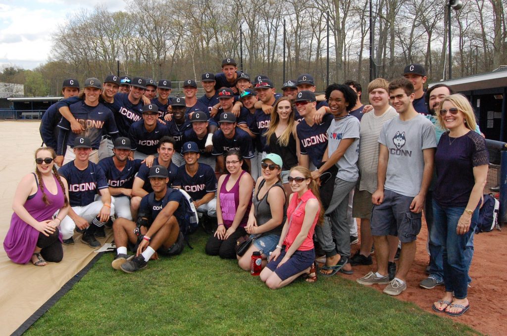 Music students and the baseball team gathered for a team photo on the field after the Huskies’ win over Cincinnati on April 30. (Kenneth Best/UConn Photo)