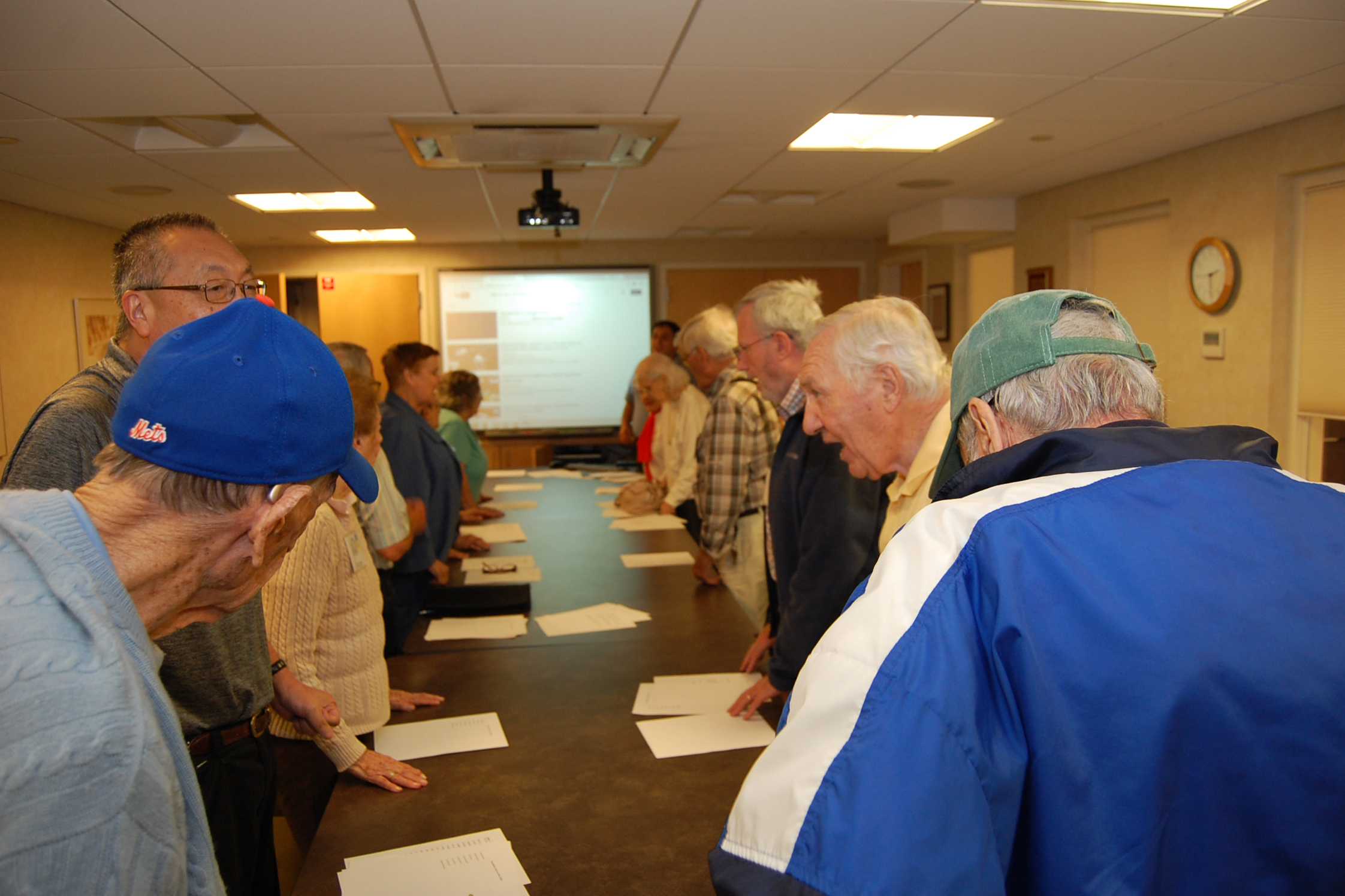 The “Seventh Inning Stretch” at the River House Adult Care Center in Cos Cobb, Connecticut, is when participants in the Baseball Reminiscence Program sing “Take Me Out to the Ballgame” during the midway point during their session. (Kenneth Best/UConn Photo)