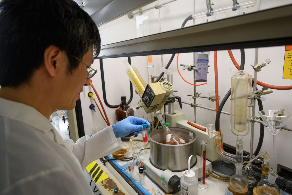 Ping Yan prepares voltage-sensitive dyes in the lab at the Cell and Genome Sciences Building at UConn Health in Farmington on Aug. 4, 2017. (Peter Morenus/UConn Photo)