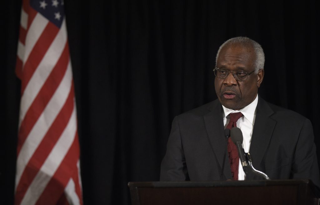 Supreme Court Justice Clarence Thomas speaks at the memorial service for former Supreme Court Justice Antonin Scalia in March 2016. (Photo by Susan Walsh-Pool/Getty Images)