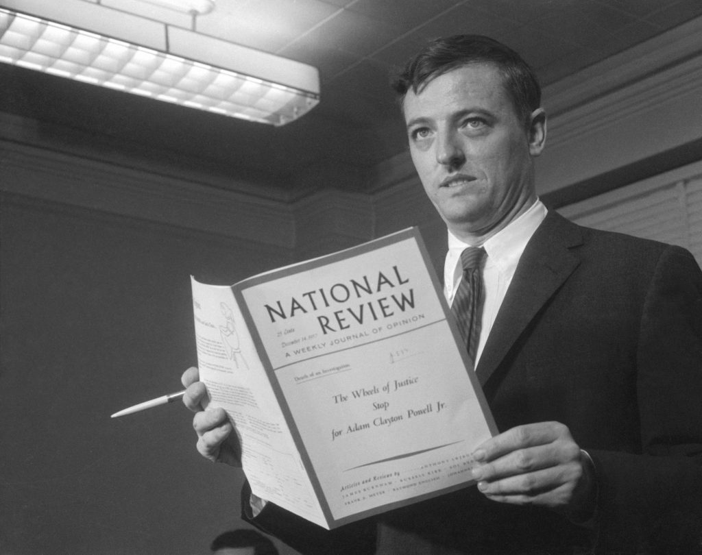 Magazine editor William F. Buckley Jr., editor of the National Review, holds a copy of the magazine as he makes a statement on the steps of the U.S. Courthouse. On the cover is the title of an article the magazine published, 'The Wheels of Justice Stop for Adam Clayton Powell, Jr.' Buckley, who admitted sending copies of the article to grand jury members investigating Powell, is facing charges of using improper influence on the jury. (Getty Images)