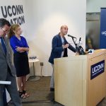 State Rep. Chris Soto, right, talks about budget cuts to the University at the Avery Point campus student center on Sept. 25, 2017.  At left are Gov. Dannel Malloy and President Susan Herbst. (Peter Morenus/UConn Photo)