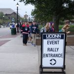 A line of students, faculty, and staff members snakes around the block in front of the Hugh S. Greer Field House. (Peter Morenus/UConn Photo)