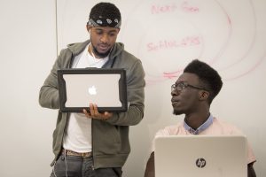 Stephen Sam ’19 (ENG, right, studying with members of the ScHOLA2RS Learning Community at Next Gen Hall. (Sean Flynn/UConn Photo)